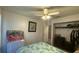 Comfortable bedroom featuring a ceiling fan and a large window at 414 Otter Creek Dr, Kissimmee, FL 34743