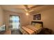 Well-lit bedroom with ceiling fan and bedside table by a window at 414 Otter Creek Dr, Kissimmee, FL 34743