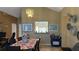 Open dining room with chandelier and a view of a window overlooking a breakfast nook at 414 Otter Creek Dr, Kissimmee, FL 34743