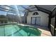 Inviting outdoor pool with a screened enclosure and a patio at 414 Otter Creek Dr, Kissimmee, FL 34743