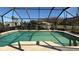 A sparkling swimming pool surrounded by a screened enclosure for added privacy at 414 Otter Creek Dr, Kissimmee, FL 34743