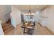 Inviting dining area featuring stylish lighting, seating, and open access to the kitchen at 452 Diamond Dove Cv, Winter Springs, FL 32708