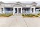 Charming townhome featuring a covered front porch with white railings and neatly landscaped surroundings at 452 Diamond Dove Cv, Winter Springs, FL 32708