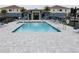 Beautiful community pool area with plenty of seating and shaded areas at 452 Diamond Dove Cv, Winter Springs, FL 32708