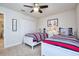 Nautical themed bedroom with two twin beds, striped bedding, and a white closet at 4768 Kings Castle Cir, Kissimmee, FL 34746