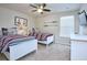 Twin beds in a bedroom with red and navy stripes and nautical decor at 4768 Kings Castle Cir, Kissimmee, FL 34746