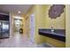 Entry hallway with a convenient granite counter, and a view of the open floor plan at 4768 Kings Castle Cir, Kissimmee, FL 34746