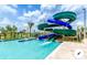 Community pool area, showcasing a thrilling multi-story water slide feature at 4768 Kings Castle Cir, Kissimmee, FL 34746