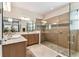 Bathroom showcasing the walk-in glass shower, neutral paint and double sink vanity at 538 Via Vitale Ct, Kissimmee, FL 34759