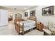 Bedroom with traditional decor, neutral color scheme, tiled floor, and natural light at 538 Via Vitale Ct, Kissimmee, FL 34759