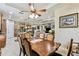 Dining room with elegant furnishings and fixtures, tile floor and views to the kitchen and Gathering room at 538 Via Vitale Ct, Kissimmee, FL 34759