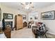 Spacious living room featuring tile floors, neutral paint, ceiling fan and comfortable seating at 538 Via Vitale Ct, Kissimmee, FL 34759