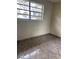 Neutral bedroom with tile flooring, offering a simple and adaptable space at 6144 Shenandoah Way, Orlando, FL 32807