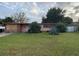 Charming single-story home with a brick exterior and well-maintained lawn at 6144 Shenandoah Way, Orlando, FL 32807