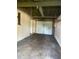 Spacious garage featuring an overhead light and functional door at 6144 Shenandoah Way, Orlando, FL 32807