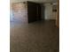 Large room featuring brick accent wall and tiled flooring at 6144 Shenandoah Way, Orlando, FL 32807