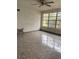 Bright and airy living room featuring tile flooring and a large window at 6144 Shenandoah Way, Orlando, FL 32807