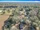 Scenic aerial perspective highlighting the home's location amidst lush trees and neighborhood streets at 6189 Nw 68Th St, Ocala, FL 34482