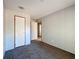 Bedroom featuring neutral carpet, light walls, and a door to another room at 6189 Nw 68Th St, Ocala, FL 34482