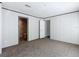 Bedroom with plush carpet and a view into the bathroom and closet at 6189 Nw 68Th St, Ocala, FL 34482