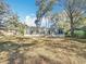 Charming single-story home featuring a gray exterior, black shutters, and a well-maintained front yard at 6189 Nw 68Th St, Ocala, FL 34482