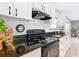 Well-equipped kitchen featuring granite countertops, modern appliances and white cabinetry at 6189 Nw 68Th St, Ocala, FL 34482