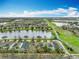 Aerial view of a lakeside neighborhood with well-maintained homes and landscaping at 6441 Point Hancock Dr, Winter Garden, FL 34787