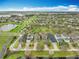 An aerial view of a planned community with ponds, landscaping and sidewalks at 6441 Point Hancock Dr, Winter Garden, FL 34787