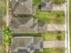 Aerial view of roofs with solar panels, brick driveways, and landscaped lawns at 6441 Point Hancock Dr, Winter Garden, FL 34787