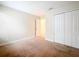 Bedroom featuring neutral carpet, closet, and light walls at 6441 Point Hancock Dr, Winter Garden, FL 34787