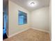 Bedroom with tile flooring, a neutral color palette, and a window allowing natural light at 6441 Point Hancock Dr, Winter Garden, FL 34787