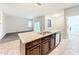 Kitchen featuring an island with granite countertop, stainless steel sink, and dishwasher, perfect for cooking at 6441 Point Hancock Dr, Winter Garden, FL 34787