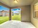 Open air patio offering views of the manicured lawn, landscaping, and lake at 6441 Point Hancock Dr, Winter Garden, FL 34787