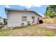 Backyard featuring a patio area, grass, and a grill at 6921 Long Needle Ct, Orlando, FL 32822