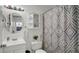 Clean bathroom featuring a vanity, toilet and shower with patterned curtain at 6921 Long Needle Ct, Orlando, FL 32822