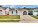 Charming single-story home featuring a well-maintained lawn and driveway at 6921 Long Needle Ct, Orlando, FL 32822