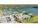 Aerial view of community pool and tennis courts near the lake at 732 Aldenham Ln, Ormond Beach, FL 32174