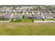 Aerial view showcasing neighborhood with green lawns and community layout at 747 Citrus Isle Dr, Davenport, FL 33837