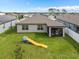 Spacious backyard with a slide, with a screened in patio at 747 Citrus Isle Dr, Davenport, FL 33837