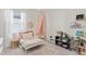 Bright bedroom with a decorative mirror, cute decor and window at 747 Citrus Isle Dr, Davenport, FL 33837