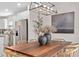 Bright dining area featuring a wooden table, contemporary lighting, and elegant decor at 747 Citrus Isle Dr, Davenport, FL 33837