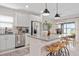 Bright, modern kitchen featuring stainless steel appliances, granite countertops, and an island with seating at 747 Citrus Isle Dr, Davenport, FL 33837