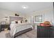 Comfortable main bedroom with a tufted headboard, ample light, and neutral decor at 747 Citrus Isle Dr, Davenport, FL 33837