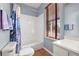 Bright bathroom featuring a shower/tub combo, neutral walls, and natural light, creating a clean and functional space at 826 Lake Evalyn Dr, Celebration, FL 34747