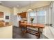 A breakfast nook features large windows, built in bench seating, and a wood table at 826 Lake Evalyn Dr, Celebration, FL 34747