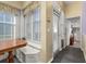 A breakfast nook featuring built in bench seating beneath large bright windows at 826 Lake Evalyn Dr, Celebration, FL 34747