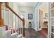 Inviting foyer with tile flooring, wood staircase, and glass-paneled french doors at 826 Lake Evalyn Dr, Celebration, FL 34747