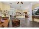 A living room and kitchen combination space featuring tile flooring, tan walls, and wood features at 826 Lake Evalyn Dr, Celebration, FL 34747