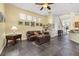 A living room featuring a leather couch, a trunk style coffee table, and warm lighting at 826 Lake Evalyn Dr, Celebration, FL 34747