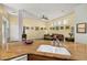 Comfortable living room with bright natural light, a ceiling fan, and tan colored walls adorned with artwork at 826 Lake Evalyn Dr, Celebration, FL 34747